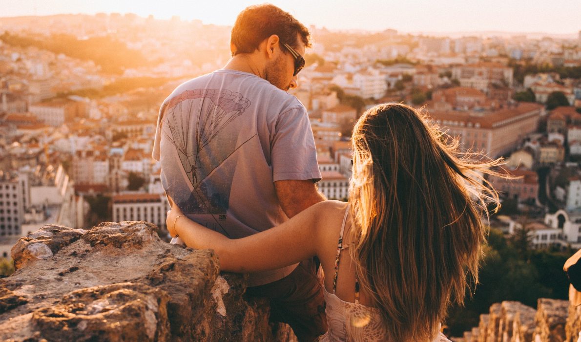 Young couple looking at a cityscape